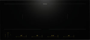 Miele induction cooktop control panel in dark, with two cooking zones marked by thin lines and yellow digital readouts along the bottom edge.