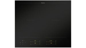 Miele black glass-ceramic induction cooktop with four cooking zones and yellow touch controls at the bottom edge