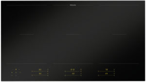 Miele black glass induction cooktop with four cooking zones and subtle guide lines on a sleek surface, brand at the top edge.