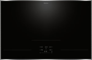 Miele black glass induction cooktop with three cooking zones indicated by thin lines and a central digital control panel, framed in stainless steel.