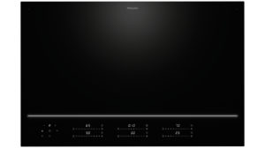 Miele black glass-ceramic induction cooktop with a glowing horizontal control line at the bottom and touch controls