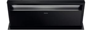 Black Miele drawer-style dishwasher with the front panel showing and the drawer slightly open.