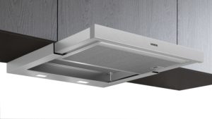 Stainless steel Siemens wall-mounted kitchen range hood with a mesh filter and built-in lights beneath cabinets.