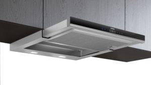 Wall-mounted Siemens range hood with metal finish and built-in control panel above a cooking area