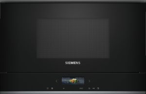 Close-up of a black Siemens oven front with a textured central panel and the Siemens logo at the bottom edge.