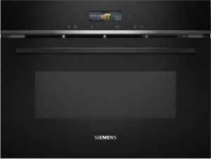 Dark gradient Siemens product image featuring a small centered display showing fresh vegetables and control icons on a sleek black appliance.