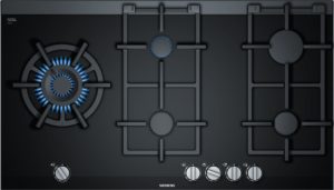 Top-down view of a dark gray gas range with blue-flame burners, central burner and control knobs along the bottom, Siemens branding visible at center bottom