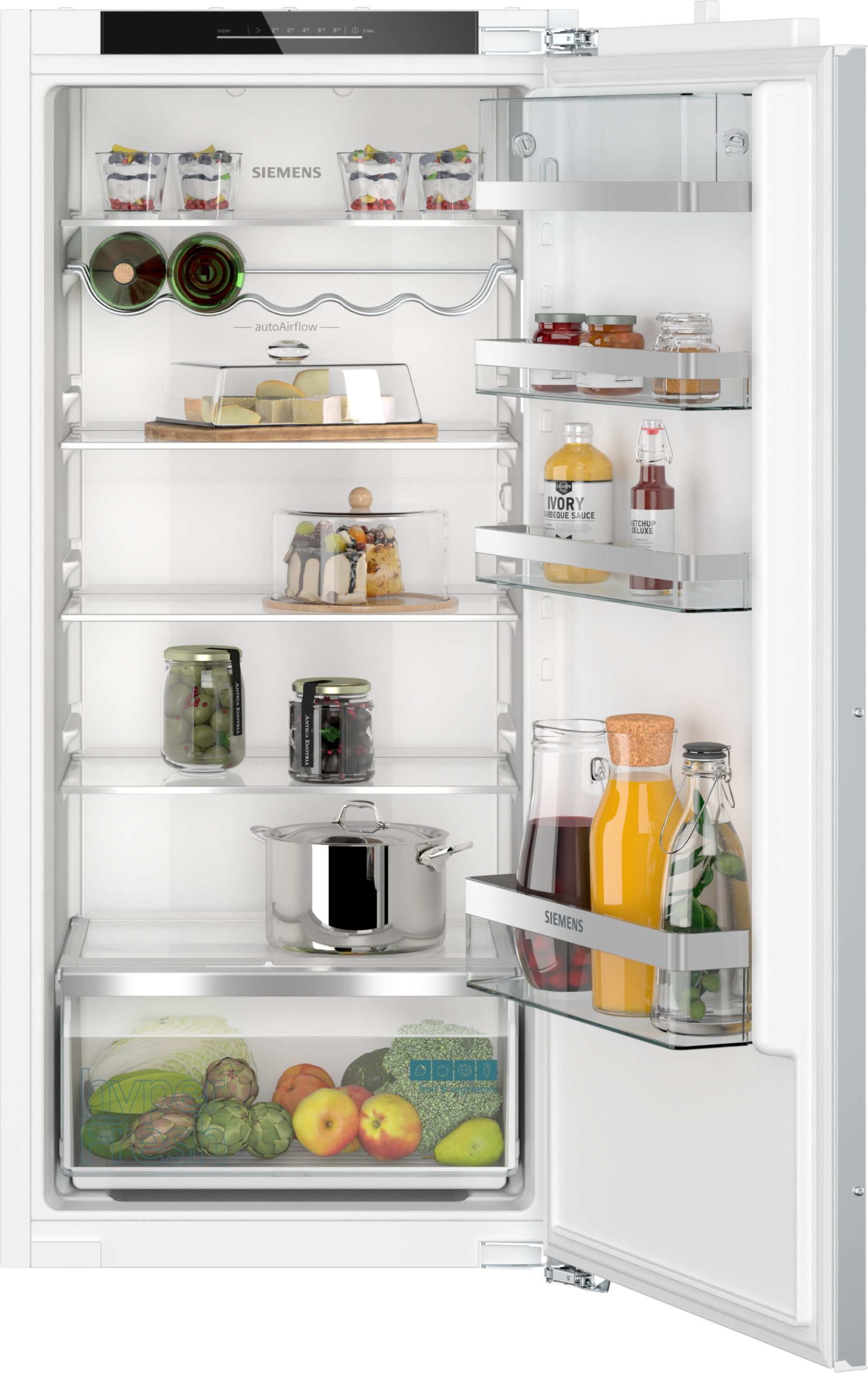 Open Siemens refrigerator interior with door shelves holding bottles and jars, a cheese tray on a middle shelf, and a bottom fruit/vegetable drawer generic overview.