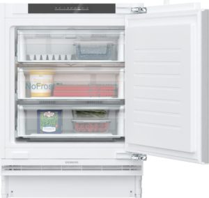 Open freezer with shelves and labeled food containers, including berries, peas, and a yogurt-style cup visible inside.