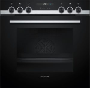 Siemens oven front with five circular control knobs and a brushed metal handle on a dark panel.