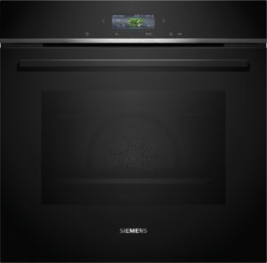 Close-up of a black Siemens appliance with a small digital display showing green beans and time indicators.