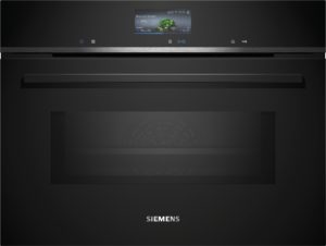 Black Siemens built-in oven with a slim control panel and small display showing broccoli florets as a cooking preset and timer.
