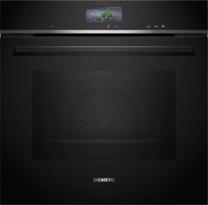 Close-up of a black Siemens built-in oven with a small touchscreen displaying broccoli florets preset.