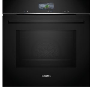 Front view of a modern black Siemens wall oven with a digital display and a long horizontal handle across the door, on a dark kitchen surface.