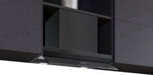 Integrated dark kitchen cabinet with a pull-out range hood; Siemens logo on the base area