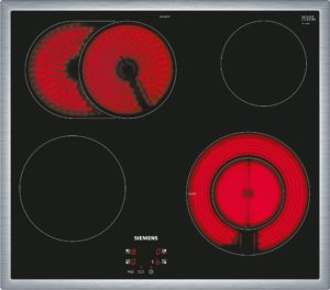 Black ceramic induction cooktop with multiple circular burners; left two zones show red glowing heating elements, center and right zones unlit; Siemens branding visible at bottom center.