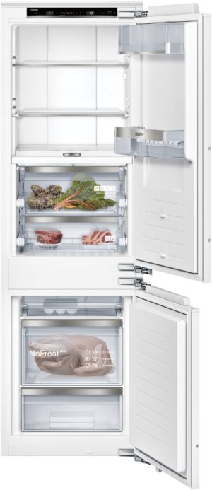 White Siemens refrigerator with bottom freezer, doors open to reveal shelves, crisper drawers, and packaged meat in the lower compartment.