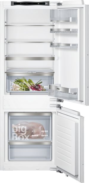 White Siemens refrigerator with doors open, showing multiple adjustable shelves, a labeled crisper drawer with vegetables, and a bottom freezer compartment.