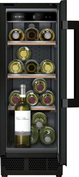 Inside a Siemens wine cooler with multiple wooden shelves, rows of horizontally stored bottles and a tall bottle foregrounded at the bottom.